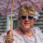 Prim and proper with a parasol at the parade