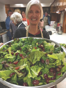 Carol Thomas serves a salad at 246 Kitchen