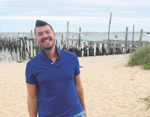 Provincetown’s Greg Salvatori enjoys a late summer day on the town beach behind his gallery at Whaler’s Wharf. (Photo Susannah Elisabeth Fulcher)